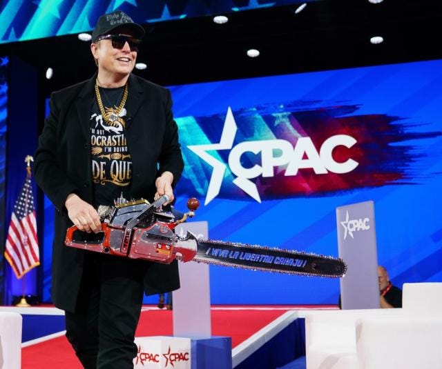 Elon Musk wields 'chainsaw for bureaucracy' on stage at CPAC to symbolize  DOGE's massive government cuts