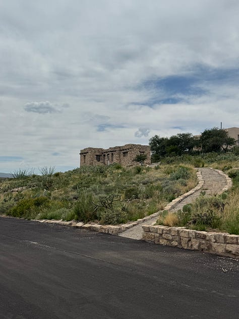 a rock cabin at Carlsbad Caverns artist residency, Bats circling the moon painting, and Ayla Yarborough and a National Park Ranger holding her painting at the NPS studio