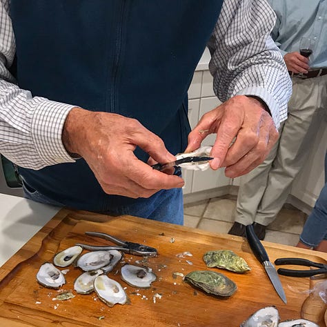 Triptych: Mens hands - Resting in lap, holding a child's hand, shucking oysters