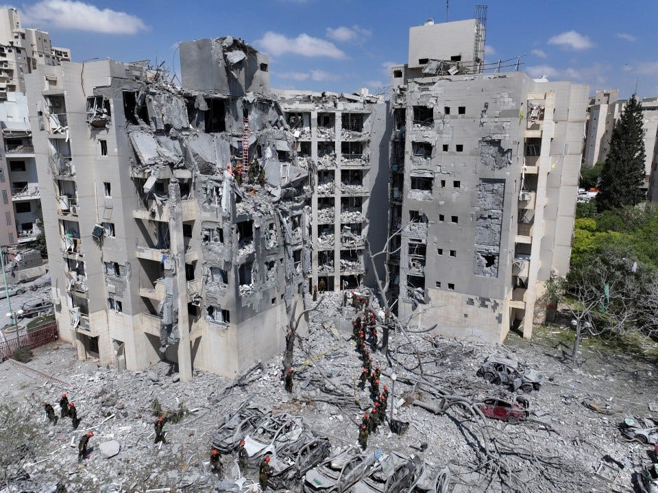 Drone view of a damaged residential building after a missile strike.