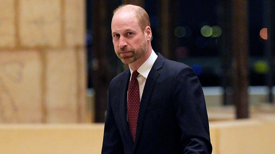 Prince William looking serious in a suit