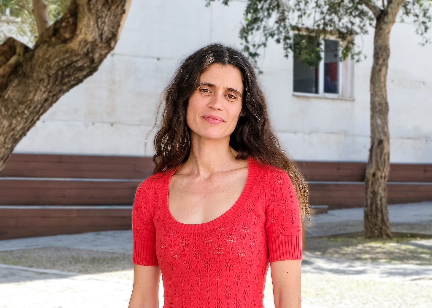 Portrait of Rita Guerra standing outdoors