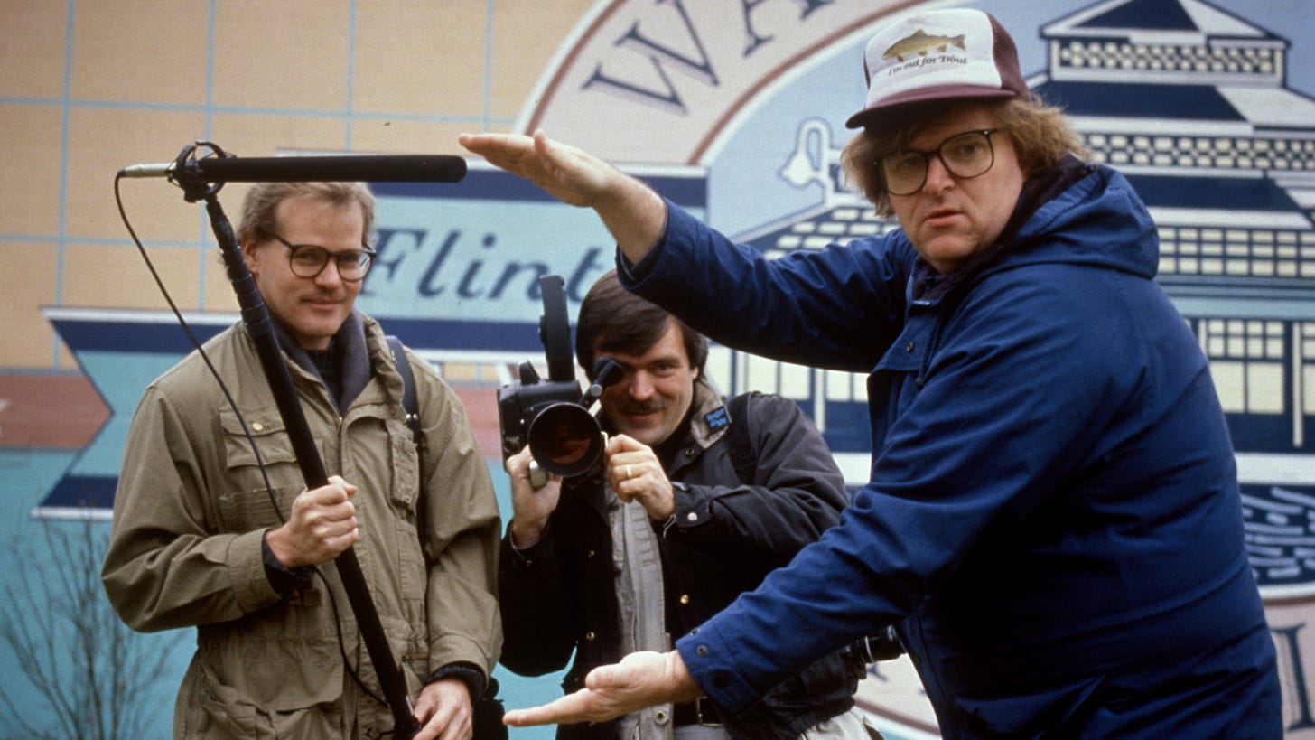 Roger & Me | Still features Michael Moore with his camera crew.