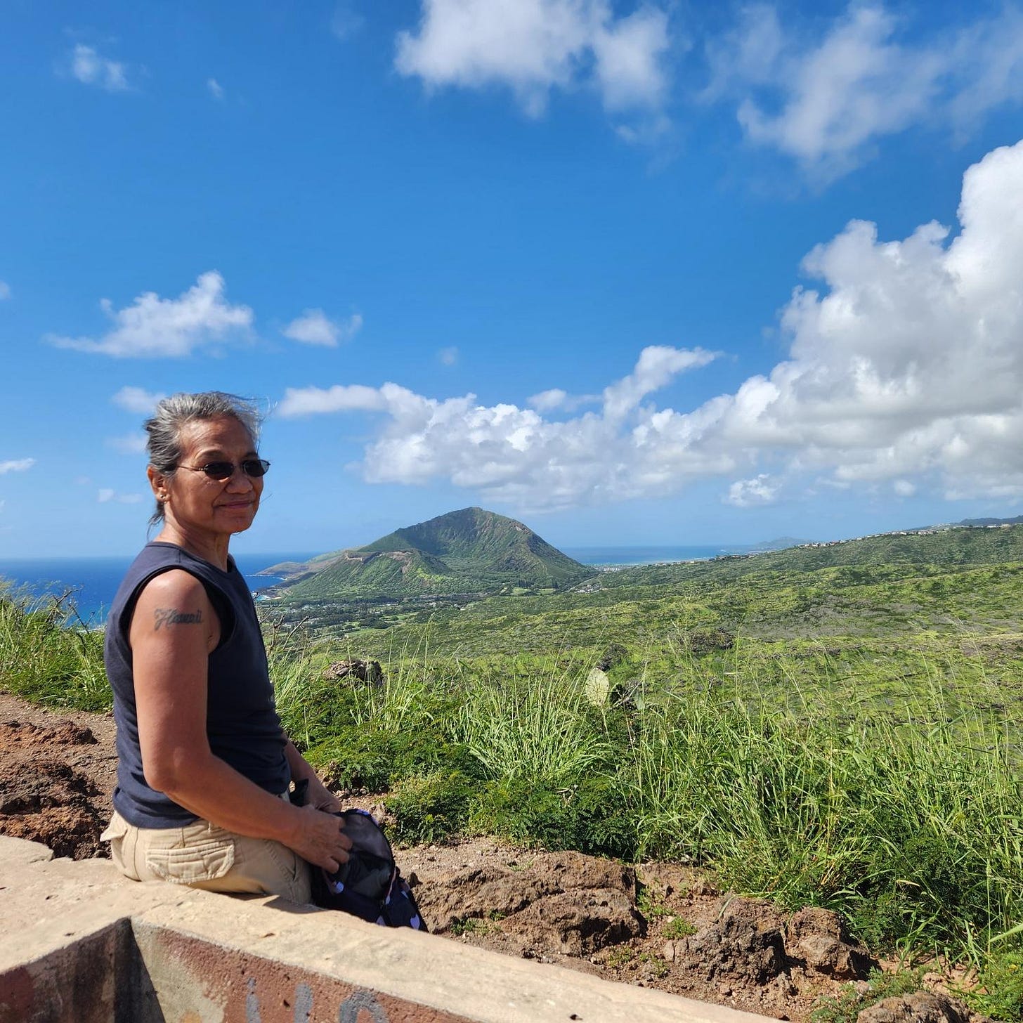 Angeline at the top of the trail with Koko Head crater in the background.