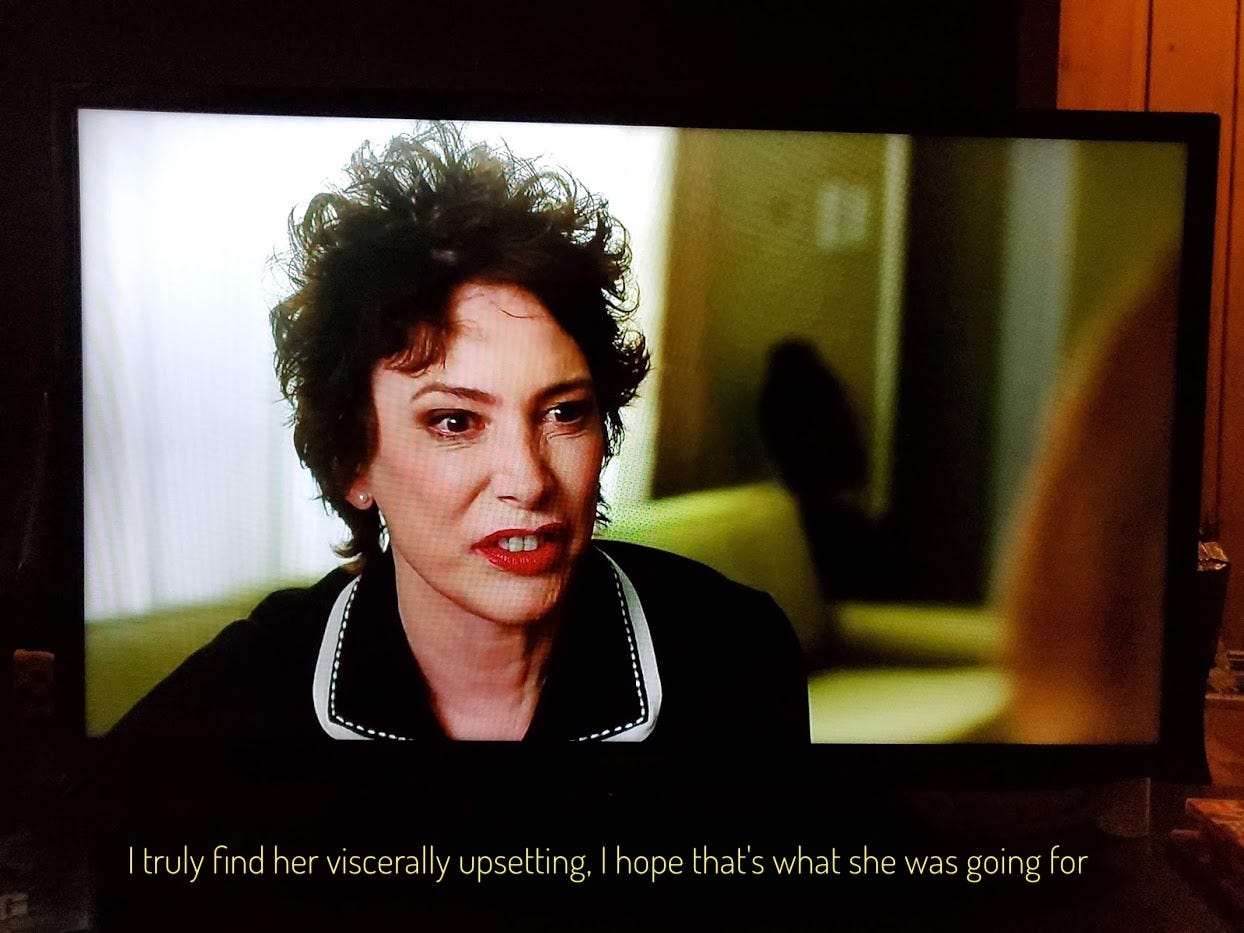 Margaret, a middle-aged white woman with a shock of black hair and a face twisted with hate, captioned "I truly find her viscerally upsetting, I hope that's what she was going for"