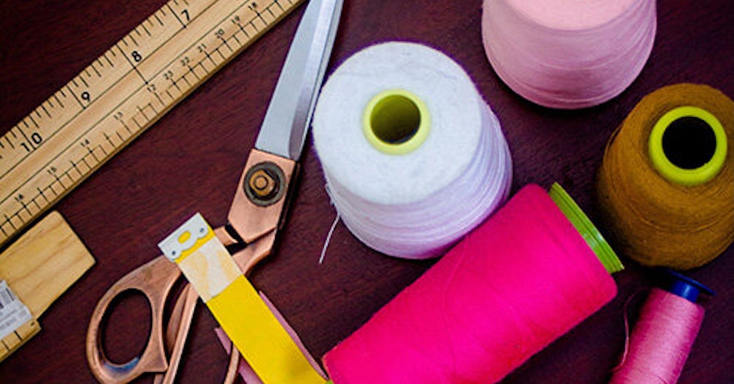 Sewing and mending tools, including thread and scissors Sewing and mending tools, including thread and scissors