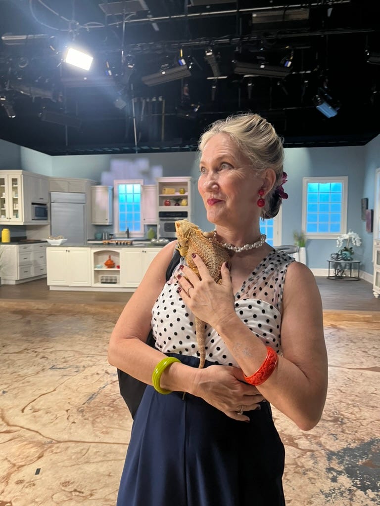 LL Kirchner with Remy the dragon on set of WFLA