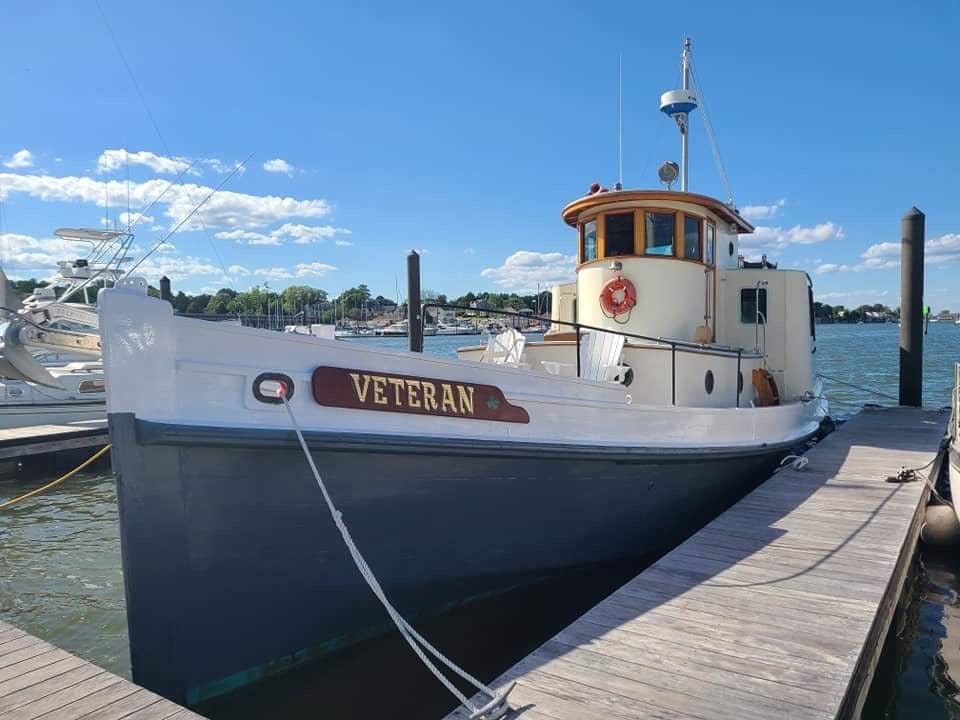 A boat tied to a dock

Description automatically generated