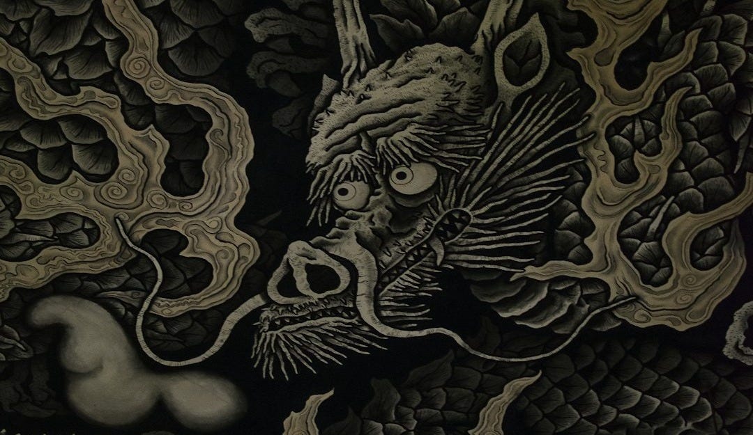 black and beige dragon-printed textile