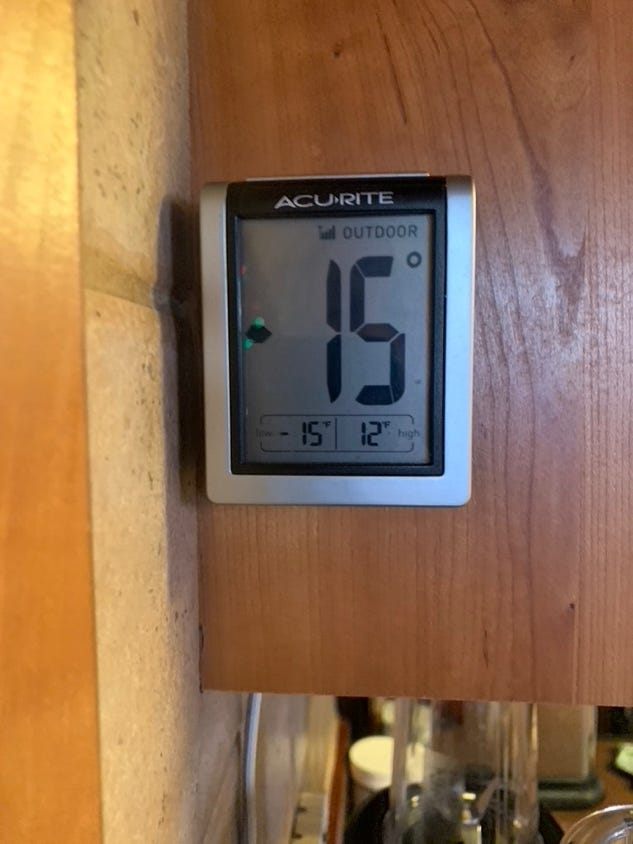 A digital thermometer on a wood surface

Description automatically generated