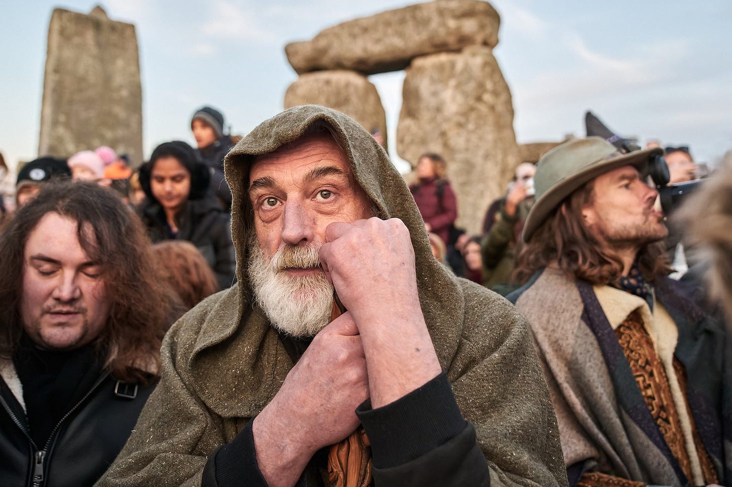 Documentary fieldwork photograph of a Druid inside Stonehenge Stone Circle, showing his contemplation at the Spring Equinox sunrise Documentary fieldwork photograph of a Druid inside Stonehenge Stone Circle, showing his contemplation at the Spring Equinox sunrise