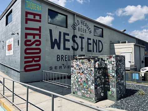 signs, lights, tables, chairs, sky