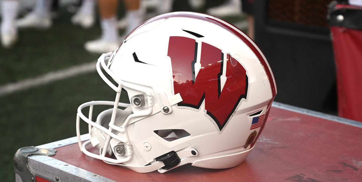 Wisconsin Badgers football helmet sitting on the sideline