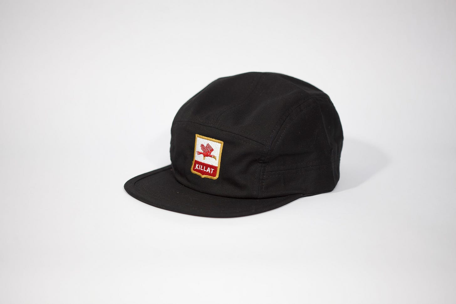 Killat Collective black cap on white background