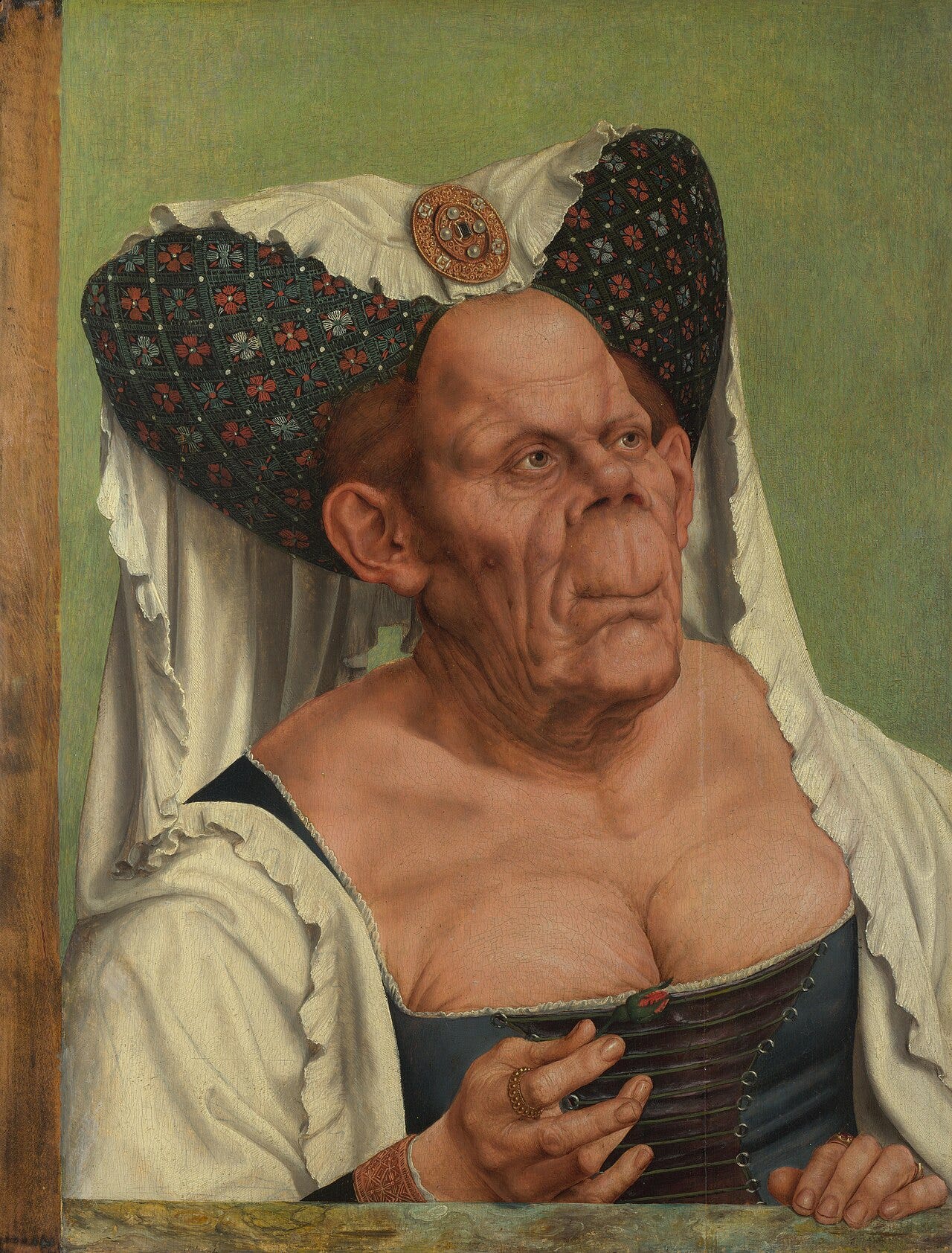 An elderly woman in an outdated headdress with exaggerated, distorted features and wrinkled skin An elderly woman in an outdated headdress with exaggerated, distorted features and wrinkled skin