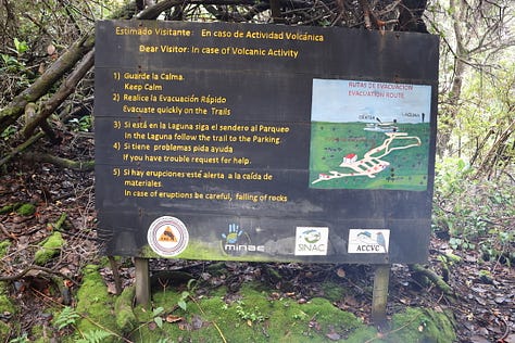 Top left shows the teal green/blue of a volcanic lake surrounded by an open crater with jungle mountains with mist in the distance. Middle top image shows the safety message for volcanic activity shelter. Top right shows the large green leaves of a plant edging the open crater of an active volcano. Middle left shows a sign in what to do in the case of volcanic activity. Middle image shows the author with the Poas Volcano crater and sulphuric acid lake in the background. Middle right shows the author with camera slung over one shoulder, a rain jacket on in front of a waterfall with a smaller waterfall in the background. The bottom left shows a cascading waterfall in the midst of thick jungle. Bottom middle shows a jaguar asleep on a log with both legs slung over each side of the log. The bottom right image shows a 'owl-eye' moth with wings up and the eye visible in the bottom right of the wing facing the camera. The moth is resting on a green leaf