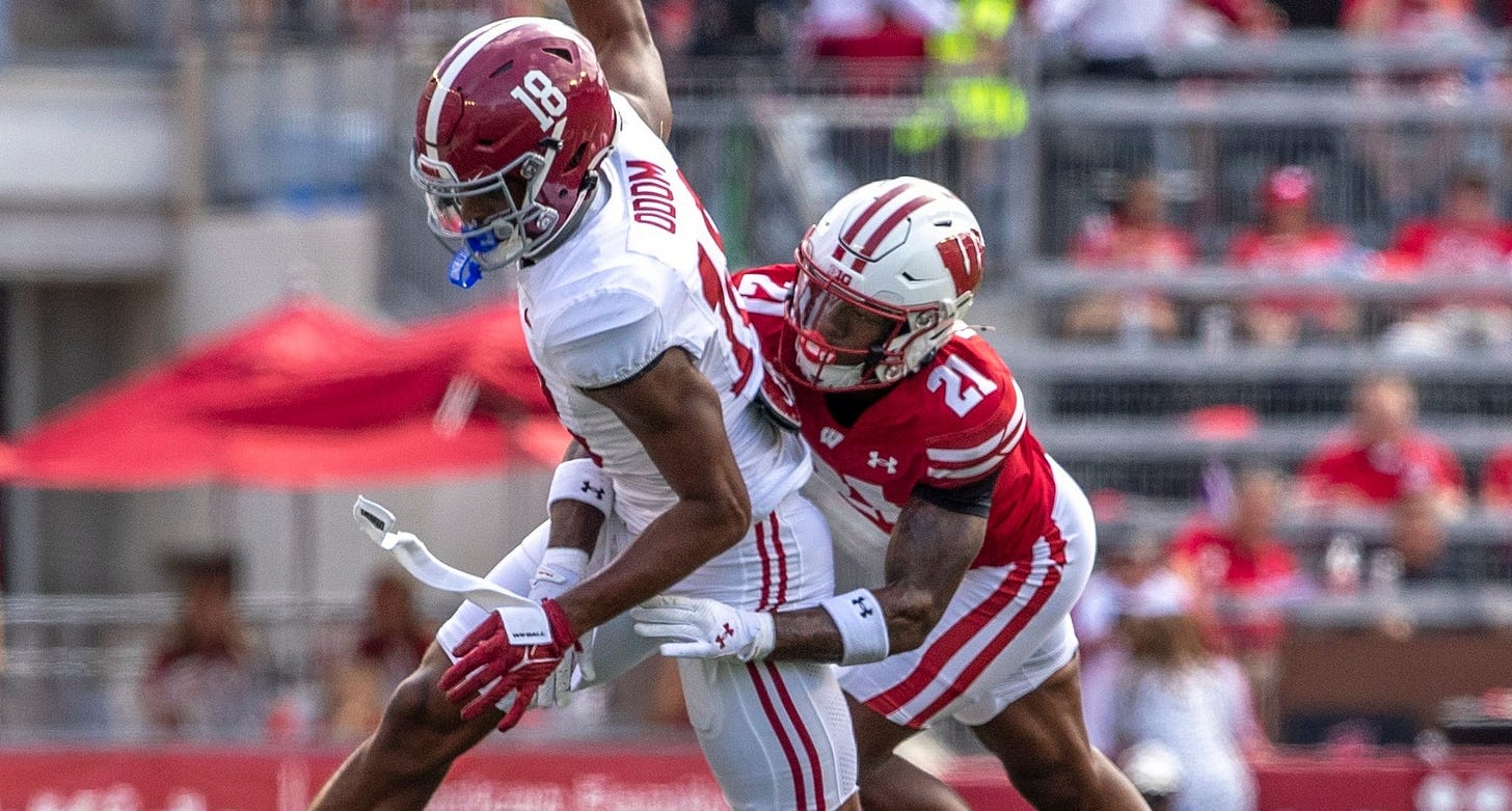 Wisconsin Badgers defensive back makes a play against an Alabama wide receiver at Camp Randall Stadium