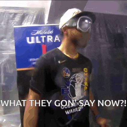 a man wearing goggles and a shirt that says golden state warriors