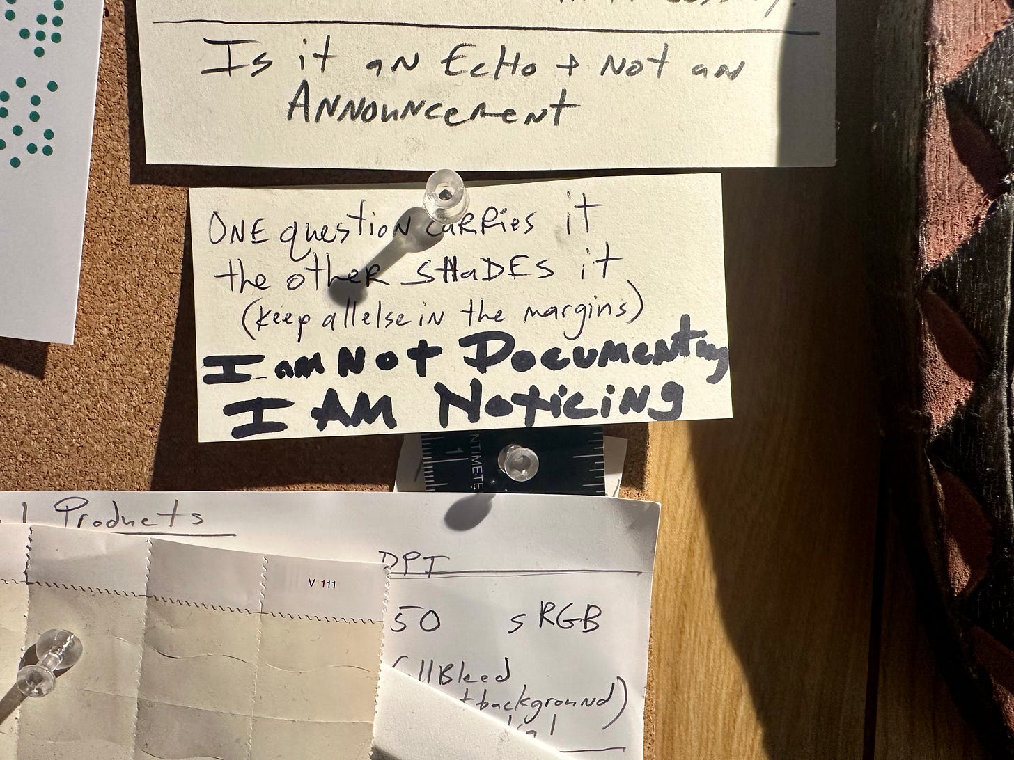 a bulletin board with notes pinned to it