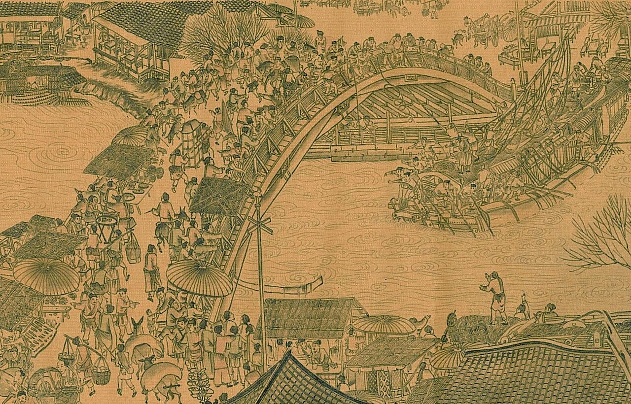 A crowded wooden arched bridge over a river with a boat below A crowded wooden arched bridge over a river with a boat below