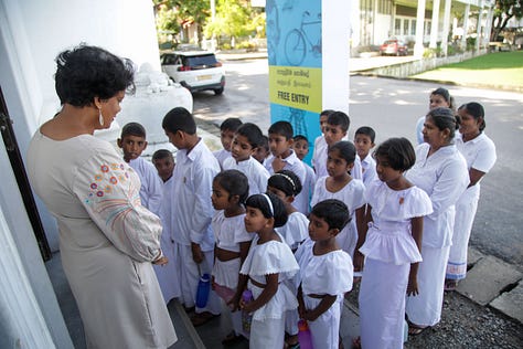 Children and Adults enjoying the Travelling History Museum's Exhibits