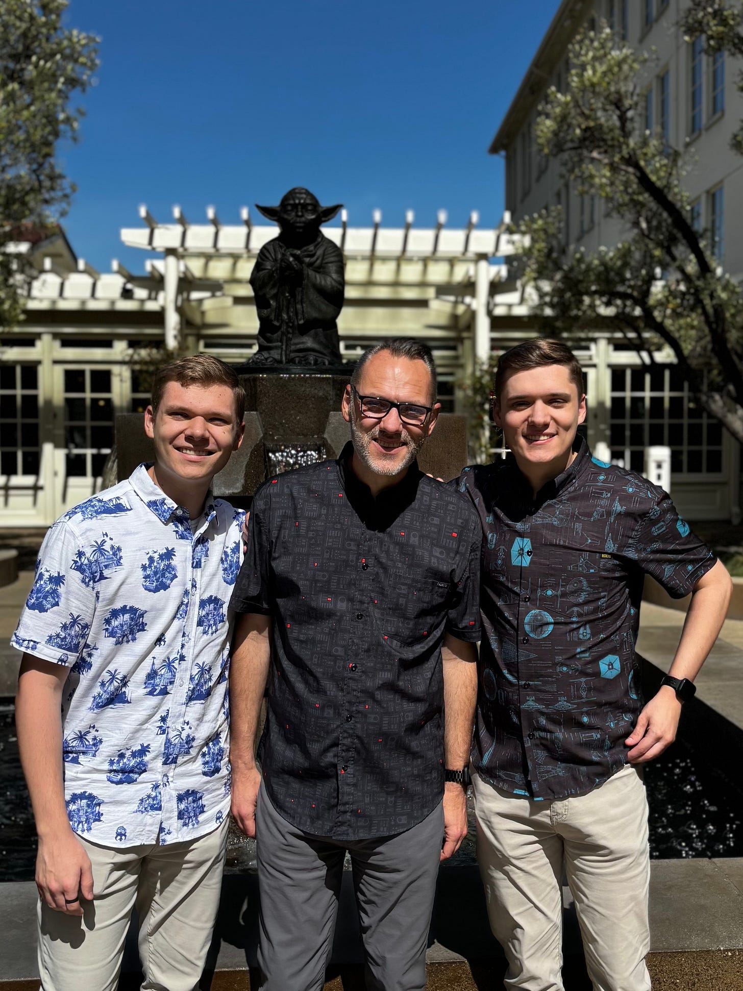 Nathan, David, and Sam in front of the iconic Yoda Fountain - A Father, Two Sons, and a Galaxy Far, Far Away - Tatooine Sons