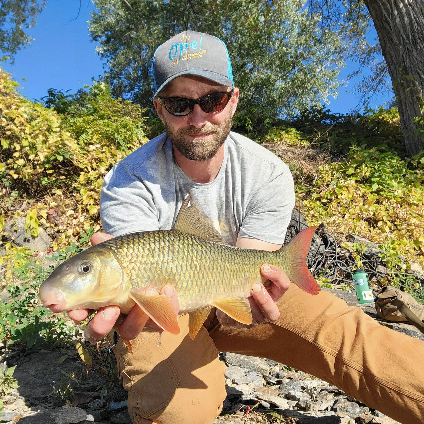 A person holding a fish

AI-generated content may be incorrect.