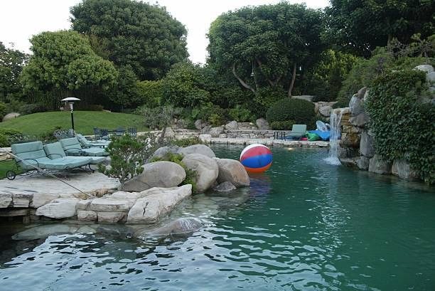 The Playboy grotto and pool pictured at the Parrots in Paradise benefit at the Playboy Mansion June 27, 2002 in Beverly Hills California. The benefit...
