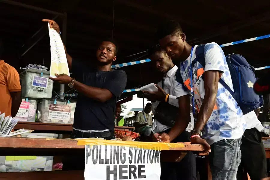 Election workers count ballots at a polling station, after polls closed, on the day of the national election, in Freetown, Sierra Leone on June 24, 2023. Election workers count ballots at a polling station, after polls closed, on the day of the national election, in Freetown, Sierra Leone on June 24, 2023.