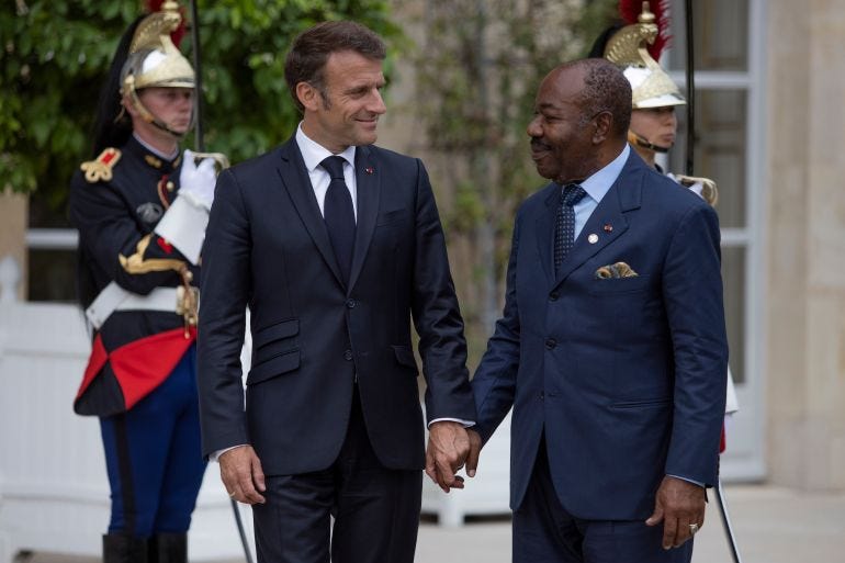 French President Emmanuel Macron, left, holds the hand of President of Gabon Ali Bongo at the Elysee Palace, Thursday, June 22, 2023 in Paris. French President Emmanuel Macron, left, holds the hand of President of Gabon Ali Bongo at the Elysee Palace, Thursday, June 22, 2023 in Paris.