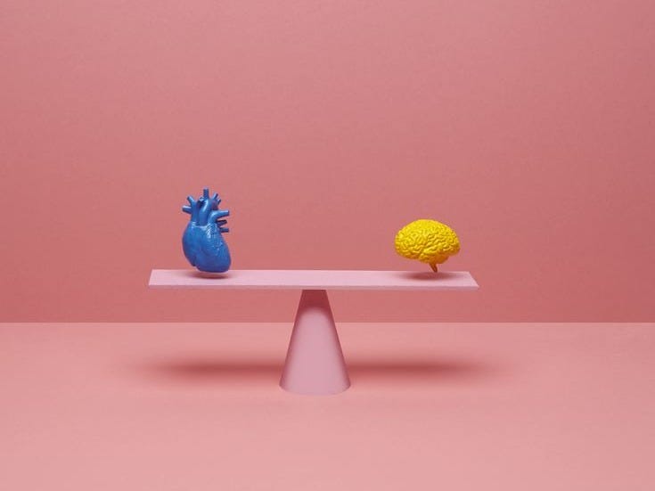 This may contain: two blue and yellow vases sitting on top of a white table next to each other