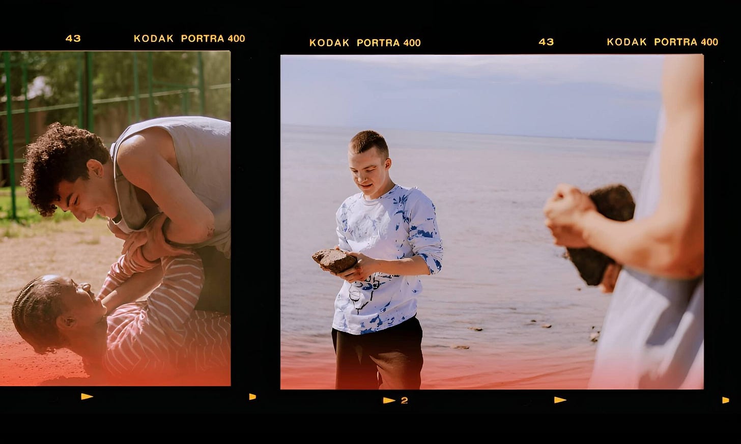 For The Subtext Review’s Overtones: Two film-strip frames capturing a moment outdoors; on the left, two boys play-wrestle and laugh on the ground; on the right, one of them looks down at a large rock in their hands while the other in the foreground holds a second stone.