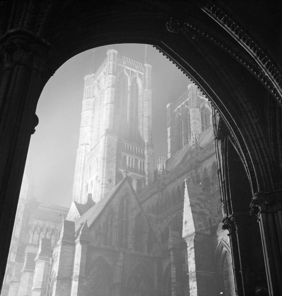 The west towers of Lincoln Cathedral lit up at night, seen from the south porch