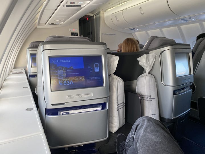 Lufthansa Boeing 747 parked at IAH airport and upper deck Business Class seat