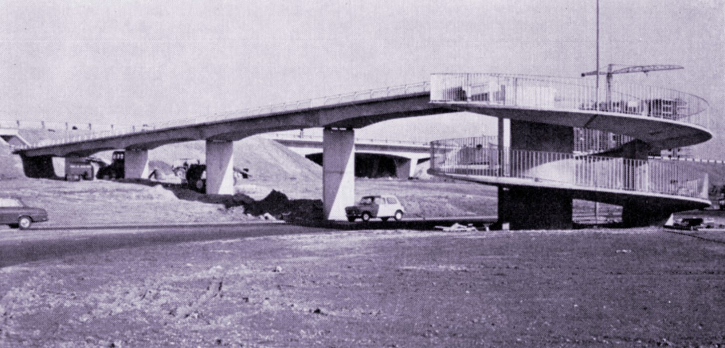 Photograph of a footbridge at Langley Interchange which ends at a spiral ramp