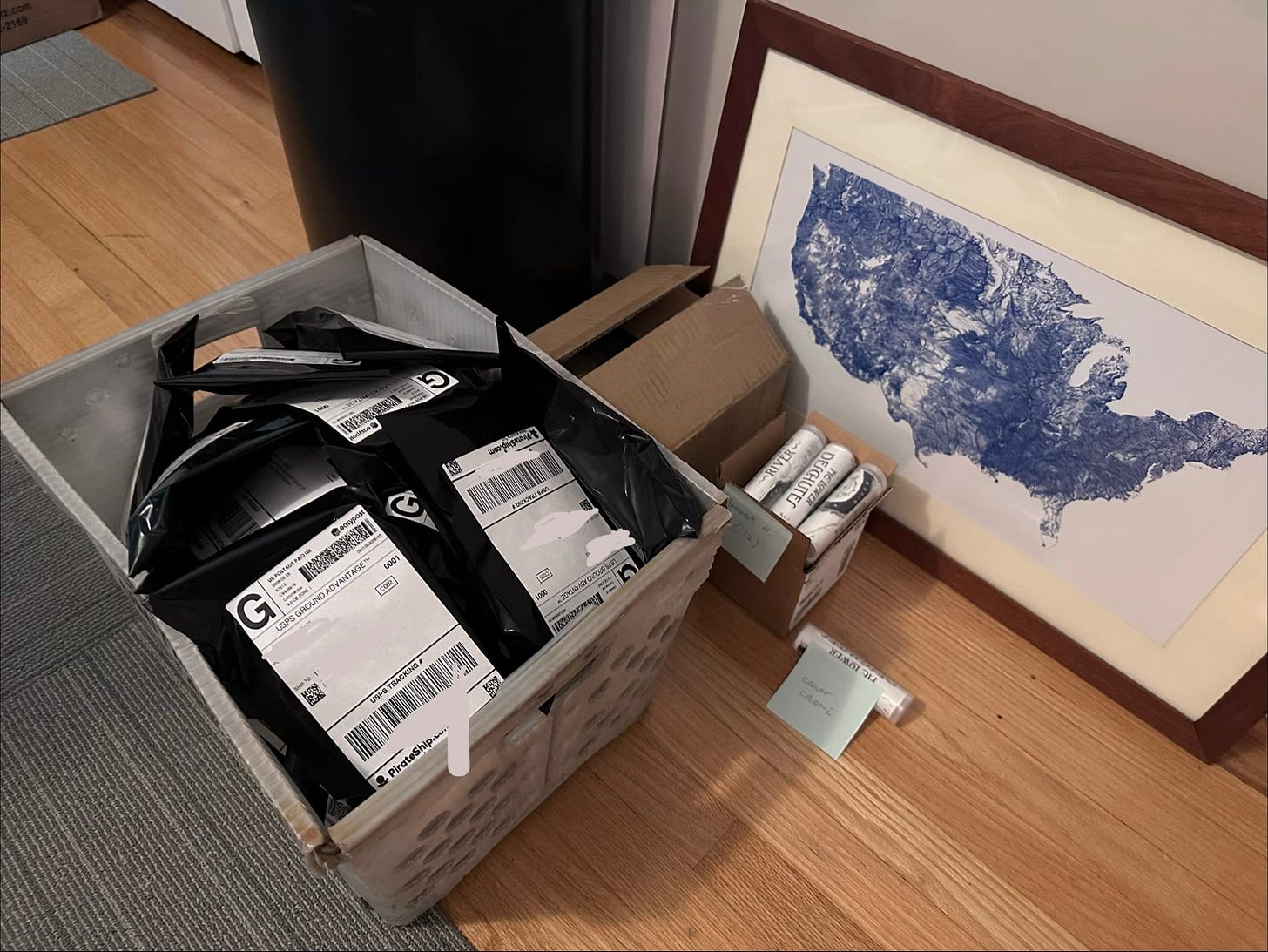 A USPS bin full of ribbon maps headed to their purchasers