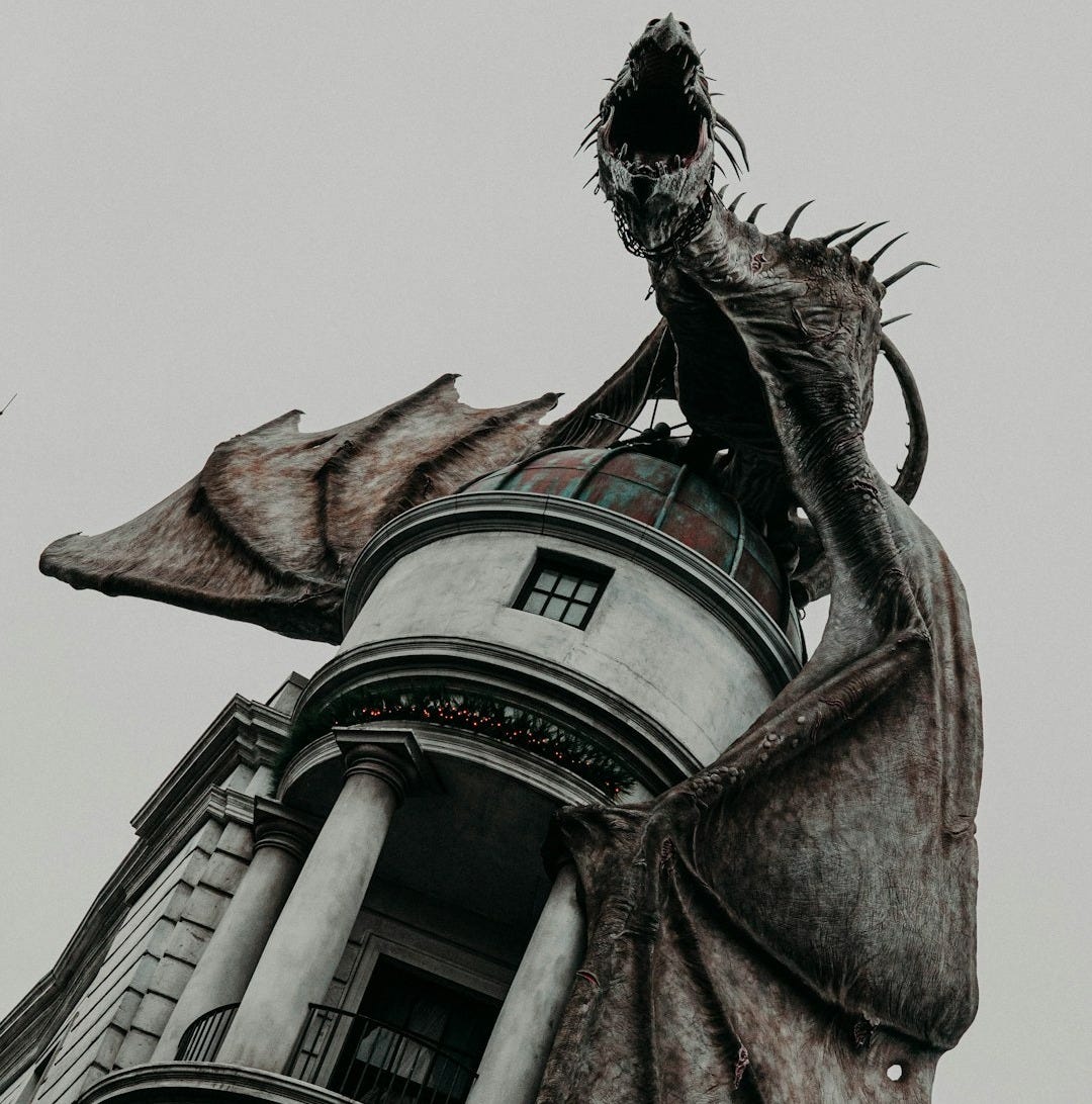 shallow focus photo of dragon on gray building