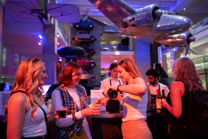 Things to do in London today: people holding drinks beneath a plane suspended from the ceiling at a Science Museum Late Things to do in London today: people holding drinks beneath a plane suspended from the ceiling at a Science Museum Late