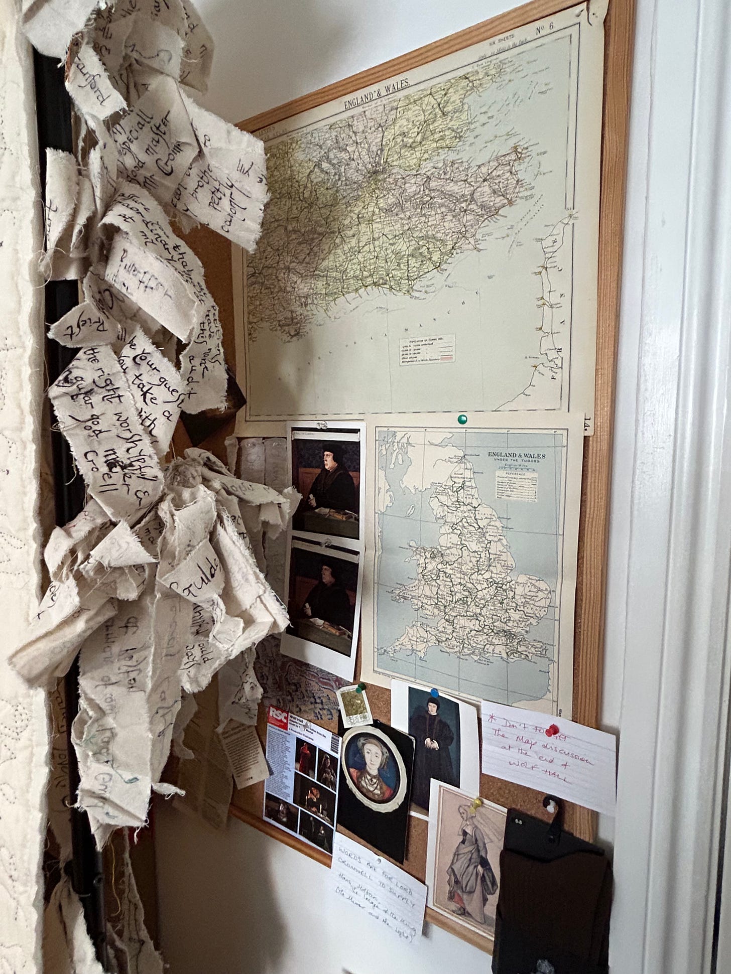 A noticeboards with maps of England, a postcard of Cromwell, pictures of Anne of Cleves, Christina of Denmark. There are textile representations of Cromwell’s correspondence hanging to the side. 