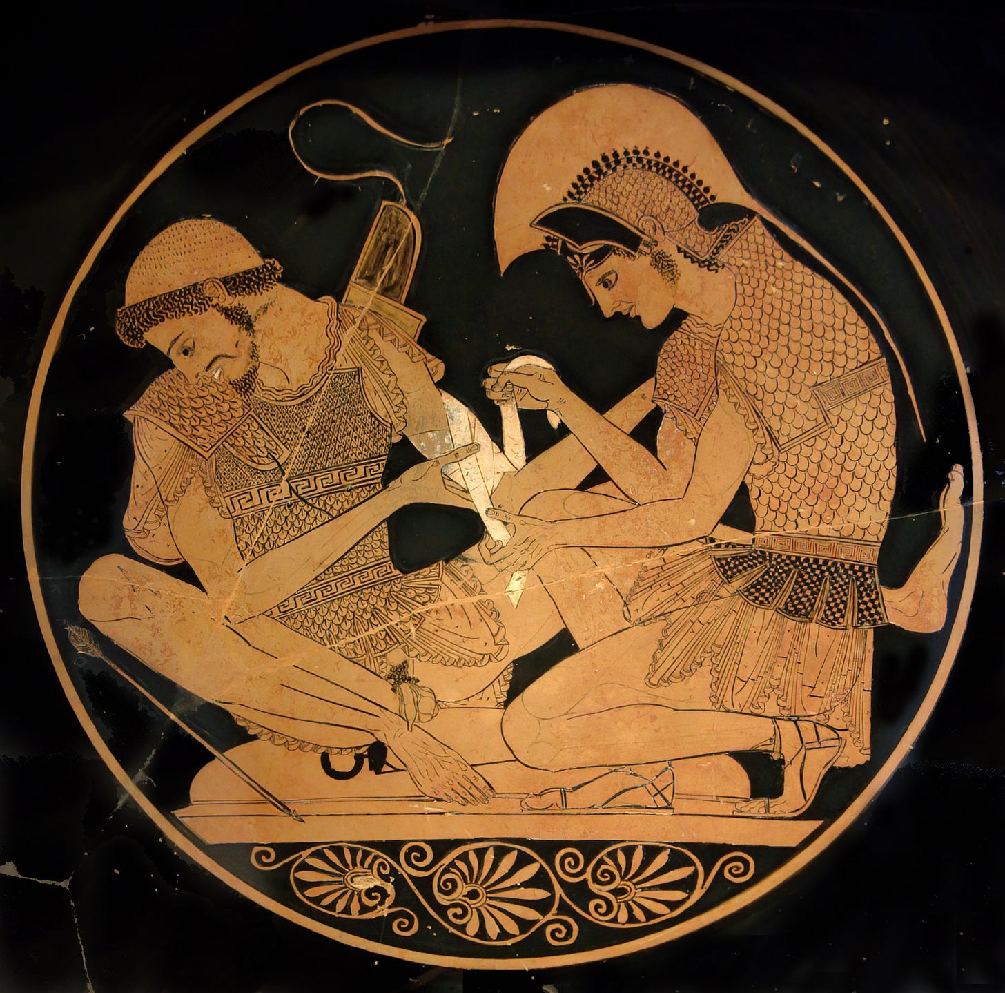 Achilles tending Patroclus wounded by an arrow, identified by inscriptions on the upper part of the vase. Tondo of an Attic red-figure kylix, ca. 500 BC. From Vulci.