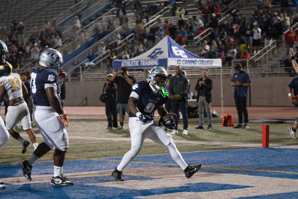 Sophomore running back Azeon Nelson of El Camino College celebrates after making a 7-yard rushing touchdown at Murdock Stadium on Sept. 6. Azeon and the Warriors went on to win the game 17-13 over No. 20 College of the Canyons. (Ryan Hirabayashi | The Union)