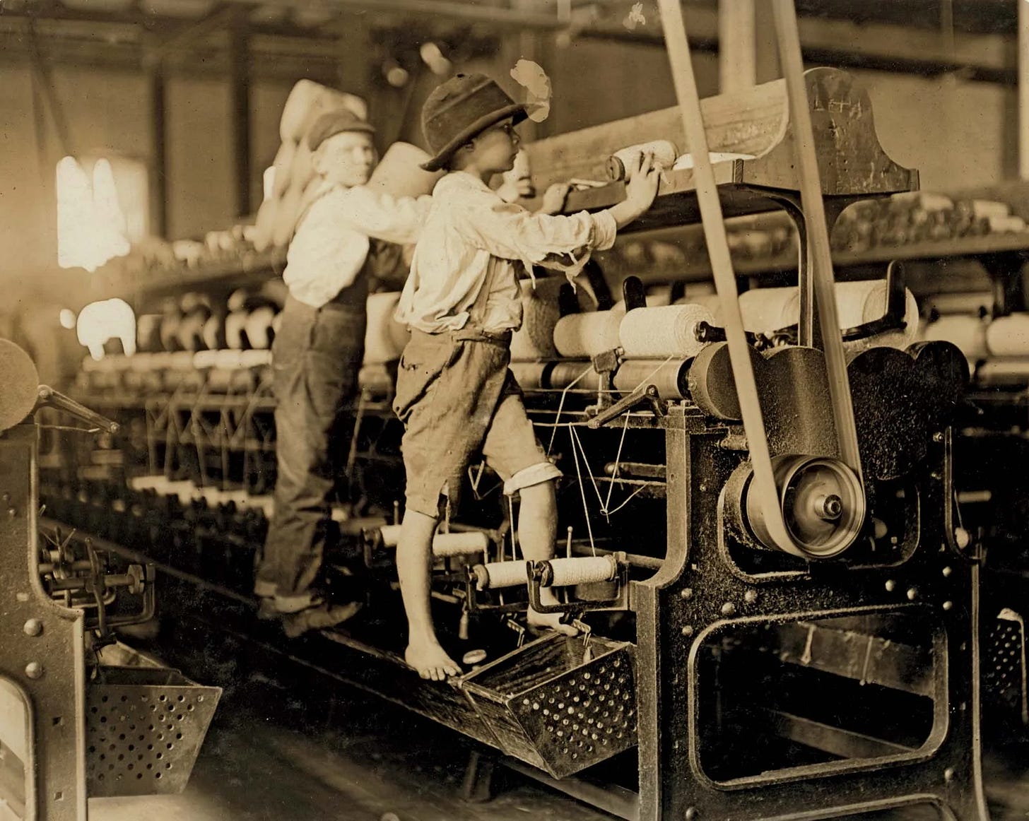 Young boys working in a thread-spinning mill, Macon, Georgia, 1909. Child labor was widespread after the Industrial Revolution. Young boys working in a thread-spinning mill, Macon, Georgia, 1909. Child labor was widespread after the Industrial Revolution.