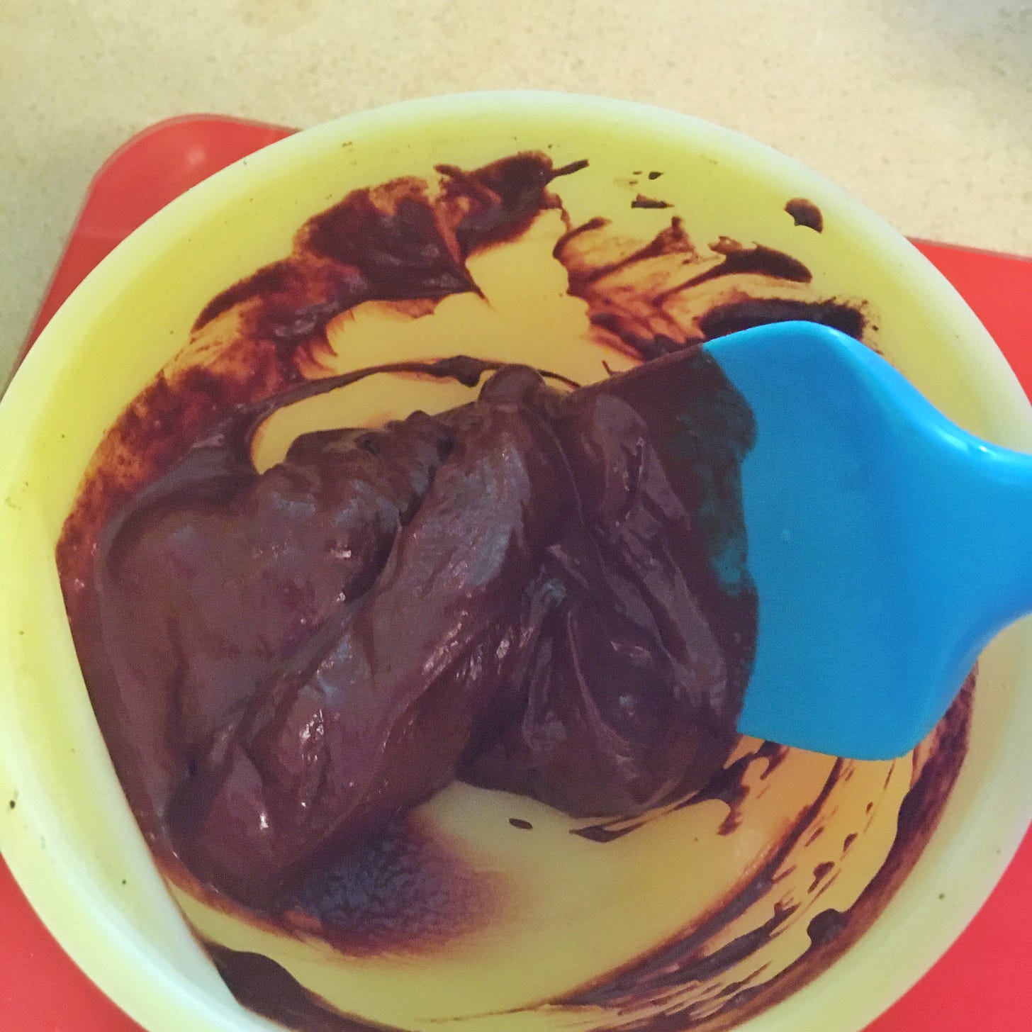 Bowl and spatula with chocolate ganache
