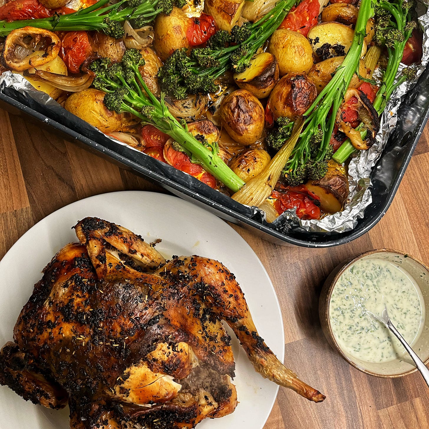 Smokey Lemon and Herb Roast Chicken, Baby Potato, Fennel and Tomato Tray Bake with a Roasted Garlic and Herb Yogurt