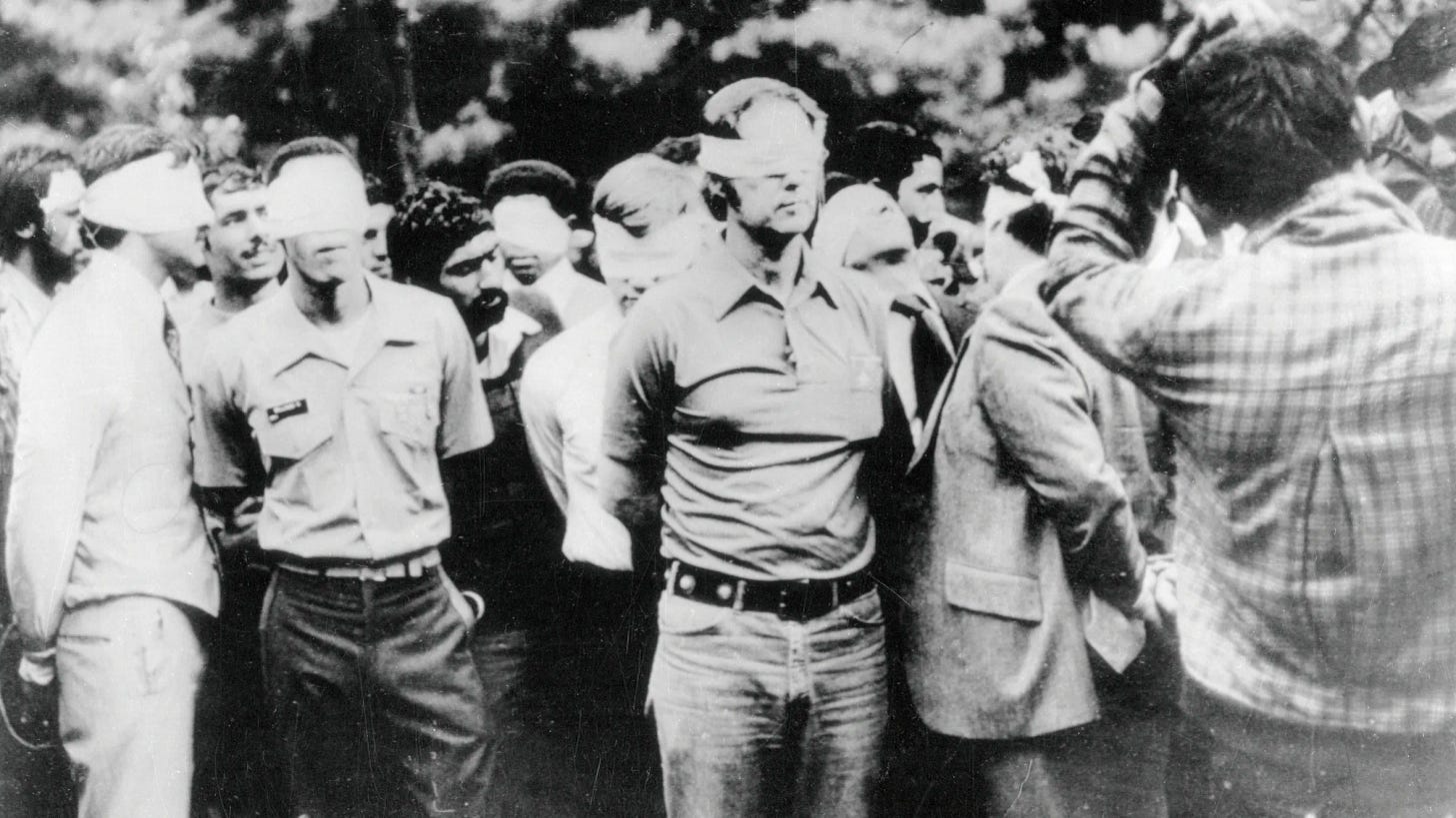 American hostages, blindfolded, being paraded by Iranian captors in Tehran.
