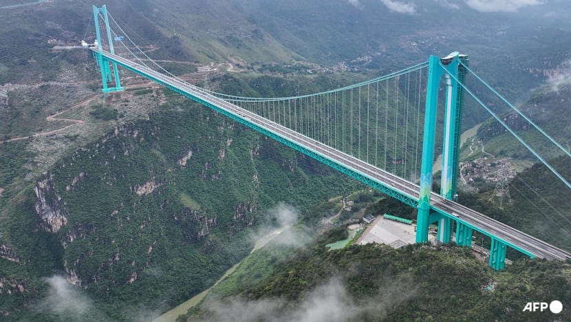 World's highest bridge opens to traffic in China World's highest bridge opens to traffic in China