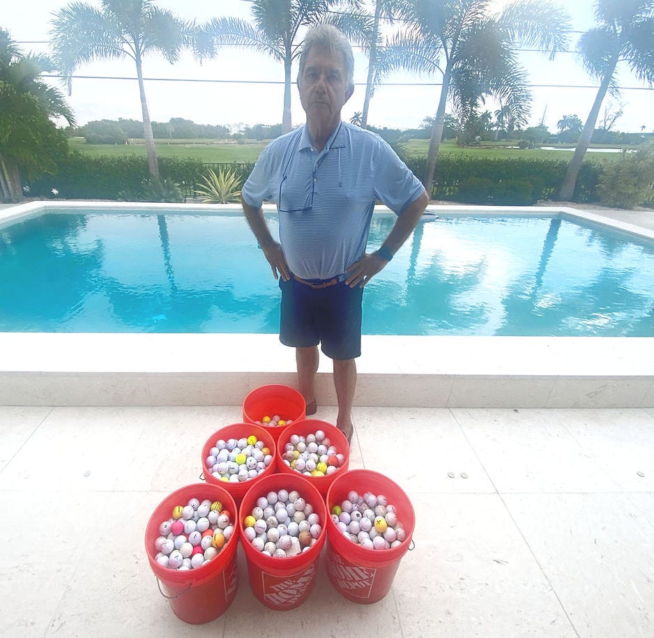 Eduardo Caneta with balls he's collected this year from his Lakeside Drive home on the golf course's third fairway. (JOE CAPOZZ)