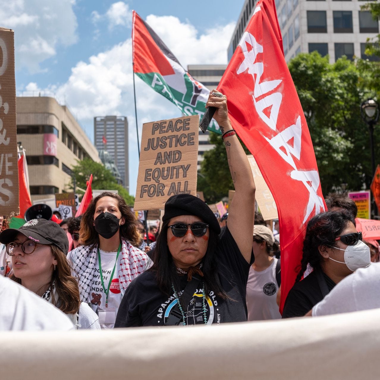 Native American and pro-Palestine activists demonstrate outside the Republican National Convention in Milwaukee, July 15. At center, a banner reads ‘Land Back,’ the name of a movement that calls for restoring the sovereignty of indigenous peoples in the U.S. and other countries.