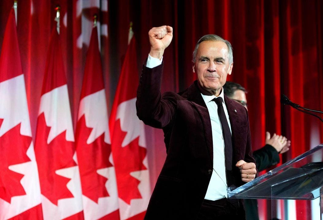 Canada's Prime Minister Mark Carney pumps his fist as he arrives to deliver  remarks at the Liberal caucus holiday party in Ottawa, on Thursday, Dec.  11, 2025. | Sandusky Register