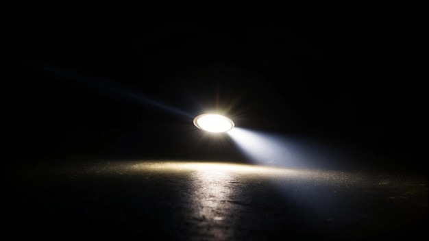 A bright light shining from a flashlight in a dark room illuminating ...